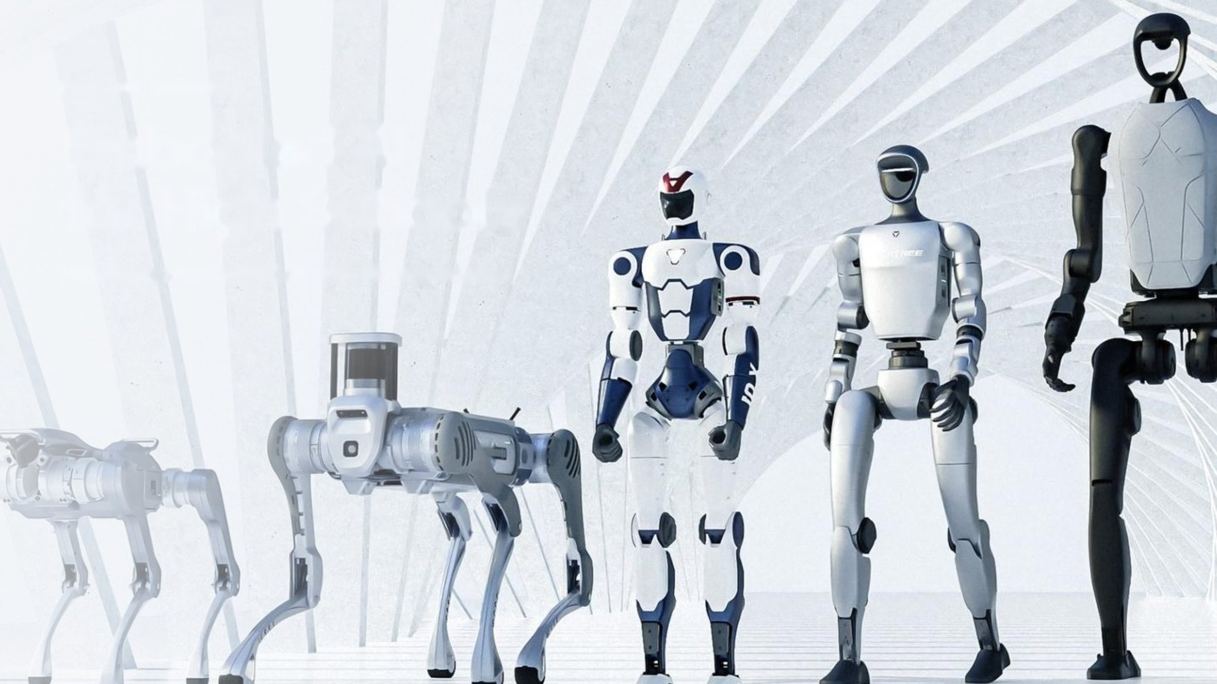 Unitree robot dogs and humanoid robots standing in a bright white hall
